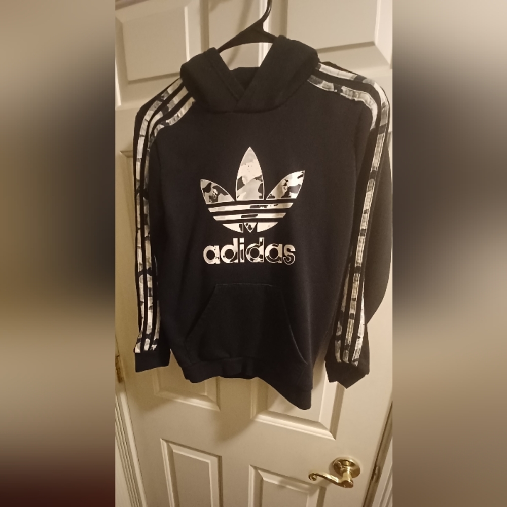Youth Adidas Originals hoodie, camo stripes and camo trefoil logo in front
